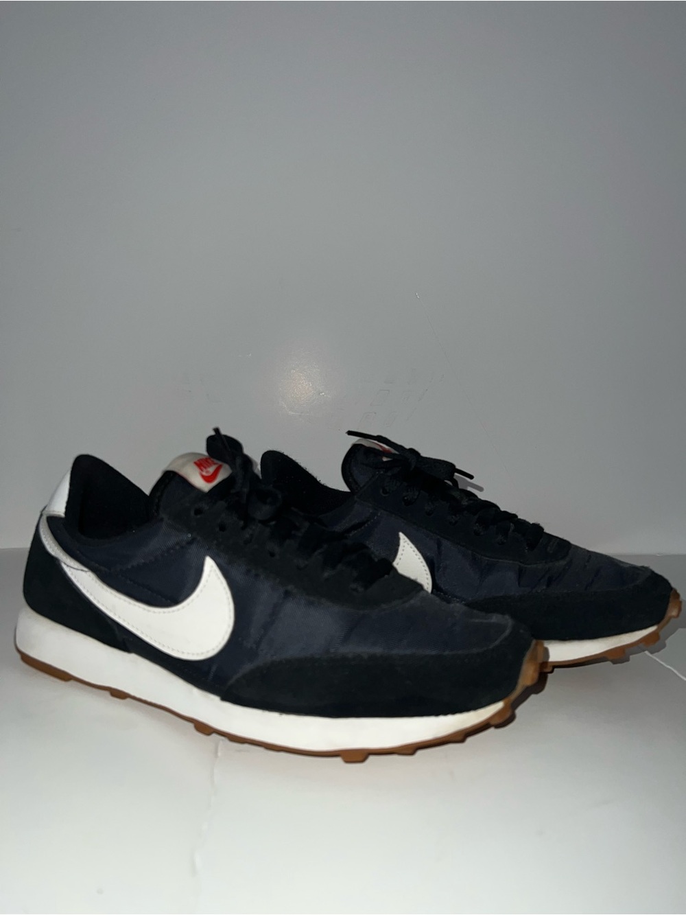 Nike women Black Trainers with White Swoosh and Gum Outsole